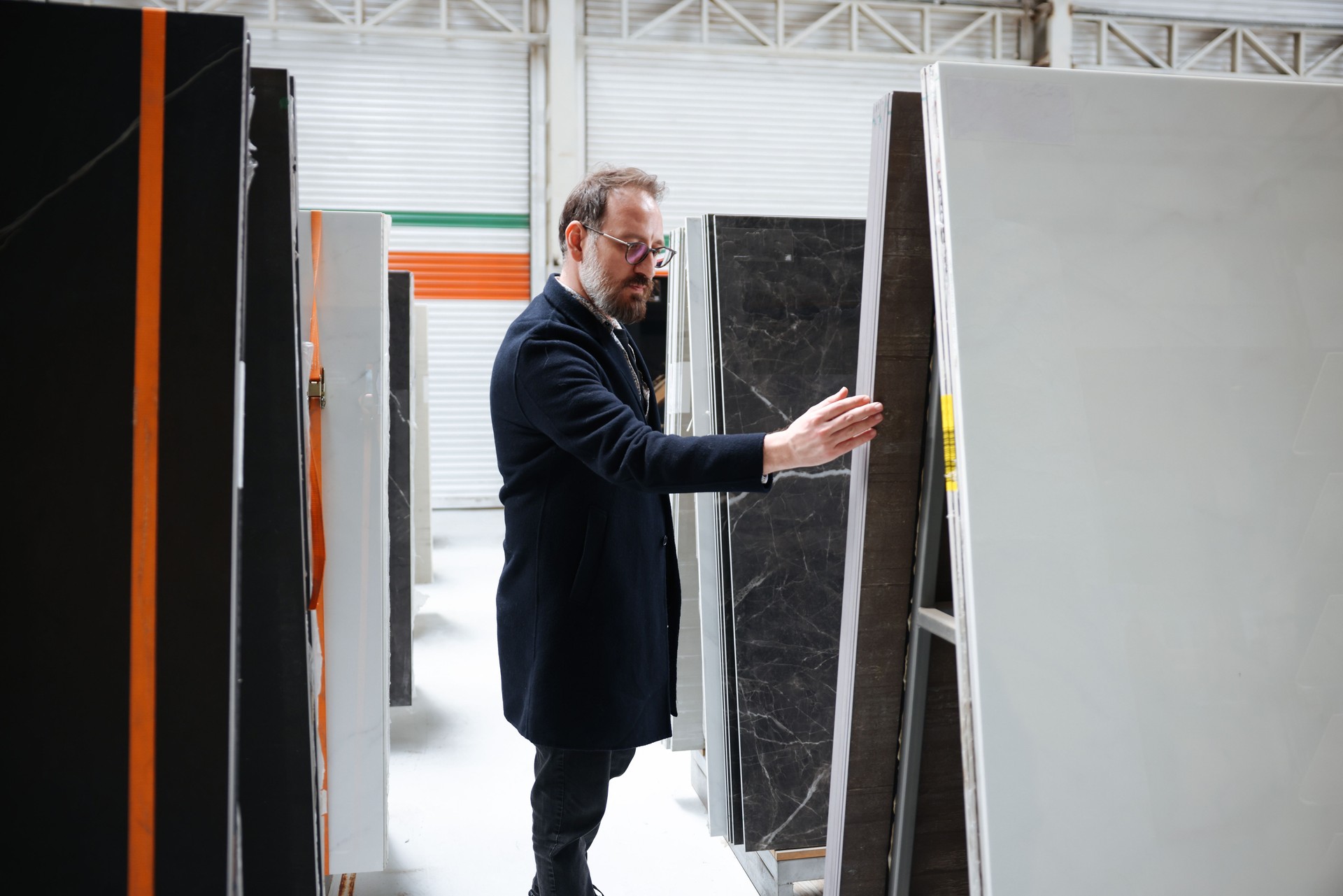 Creative male interior designer and customer choosing marble stone color